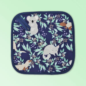 Insulated pot holder with an Aussie Animals pattern on the fabric and a dark navy edging with a hang tab.