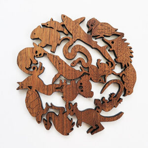 A round wooden Australian animals design trivet