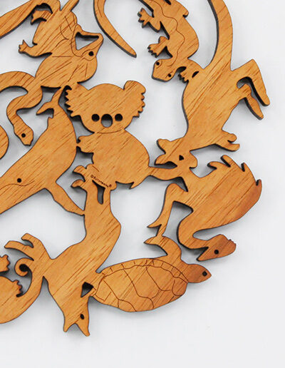 A round wooden Australian animals design trivet