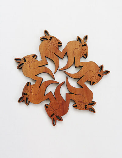 A round wooden kangaroo design trivet