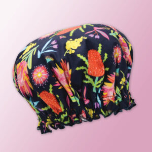 A waterproof shower cap with Aussie Flora fabric on the outside