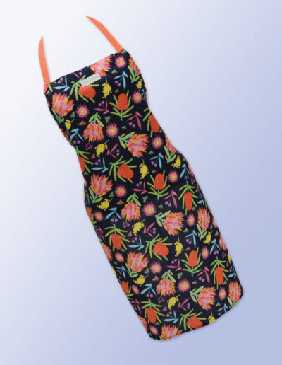 Fabric kitchen apron, dark navy with Aussie Flora print on it