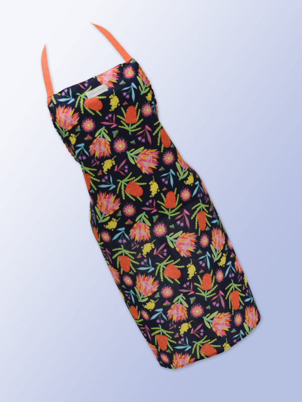 Fabric kitchen apron, dark navy with Aussie Flora print on it