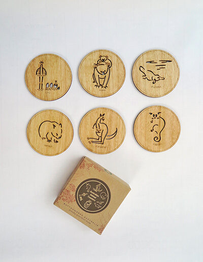 Set of six wooden coasters and their recycled cardboard presentation box. Each coaster is a different animal. They are Emu, Koala, Wombat, Platypus, Kangaroo and Possum