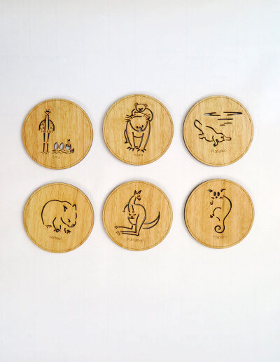 Set of six wooden coasters. Each coaster is a different animal. They are Emu, Koala, Wombat, Platypus, Kangaroo and Possum