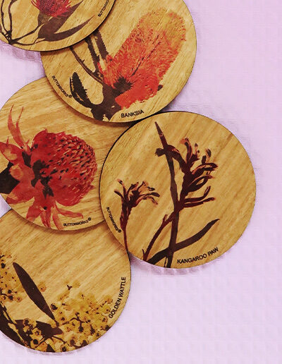 Set of six wooden coasters. Each coaster is a different coloured native flower of Australia.