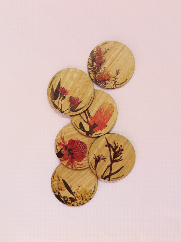 Set of six wooden coasters. Each coaster is a different coloured native flower of Australia.
