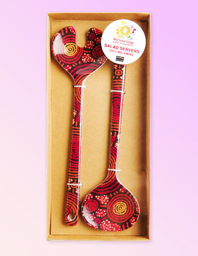 Melamine salad server set with artwork by Teddy Gibson printed on them. Shown here in the see through presentation box