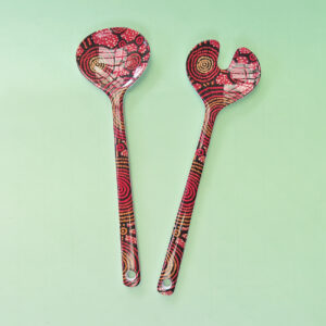 Melamine salad server set with artwork by Teddy Gibson printed on them.