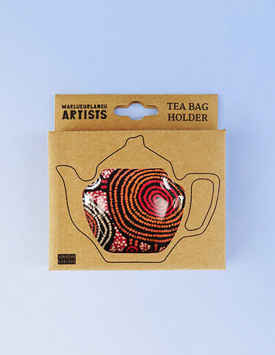 Melamine tea bag holder in the shape of a teapot inside its recycled cardboard presentation box.