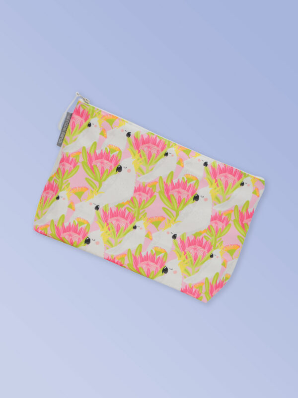 Large waterproof cosmetic bag with a pink cockatoo pattern on it and a zip closure.