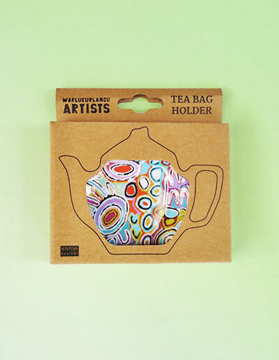Melamine tea bag holder in the shape of a teapot inside its recycled cardboard presentation box.