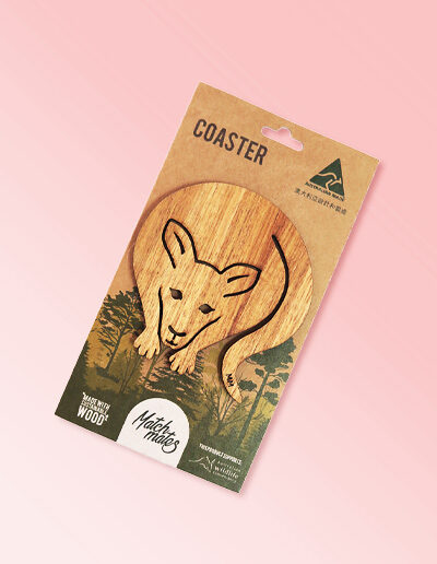 A wooden kangaroo shape coaster on a recycled card for presentation