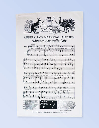 A white cotton tea towel with Australia's National Anthem in words and music on it.
