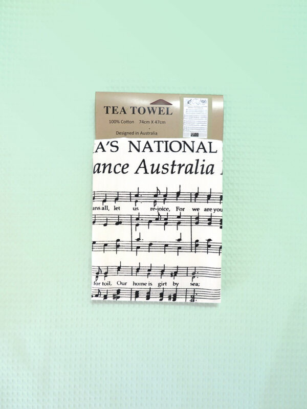 A white cotton tea towel with Australia's National Anthem in words and music on it.