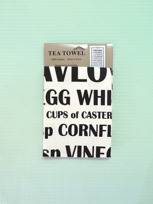 A white cotton tea towel with a Pavlova recipe printed in black on it.