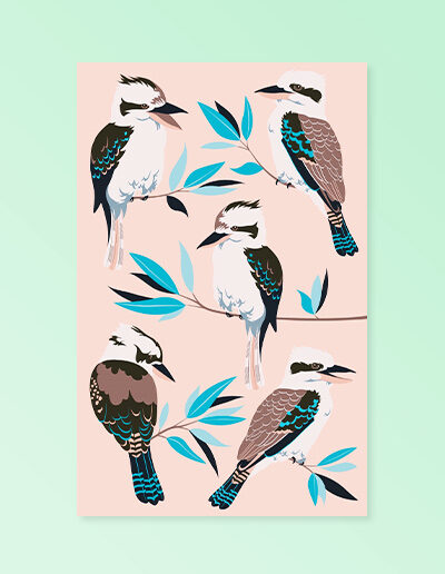 A light pink cotton tea towel with Kookaburra images printed on it.