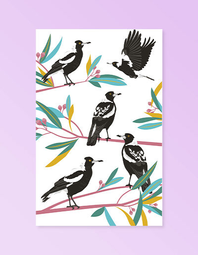 A cream cotton tea towel with Magpie images printed on it.