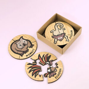 Wooden Australian Animal jigsaw puzzle set. A set of 6 different three piece animal jigsaws. Each is a round shape. They are packaged in a recycled cardboard presentation box