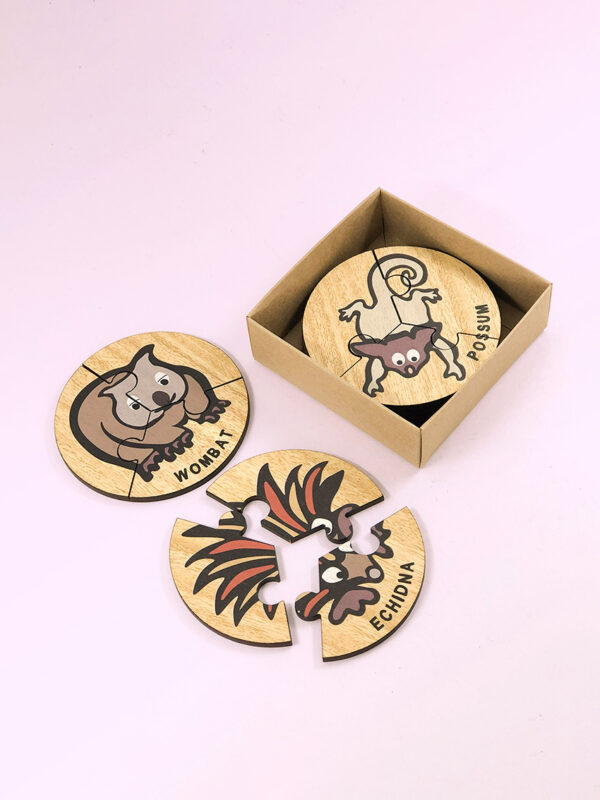 Wooden Australian Animal jigsaw puzzle set. A set of 6 different three piece animal jigsaws. Each is a round shape. They are packaged in a recycled cardboard presentation box