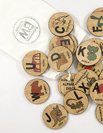 Wooden Australian Alphabet discs. 26 round wooden discs every letter of the alphabet and an image to go with that letter. e.g N is Ned Kelly.