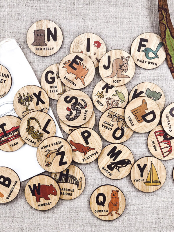 Wooden Australian Alphabet discs. 26 round wooden discs every letter of the alphabet and an image to go with that letter. e.g N is Ned Kelly.