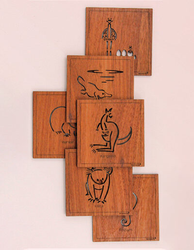 Set of six wooden square coasters and their recycled cardboard presentation box. Each coaster is a different animal. They are Emu, Koala, Wombat, Platypus, Kangaroo and Possum