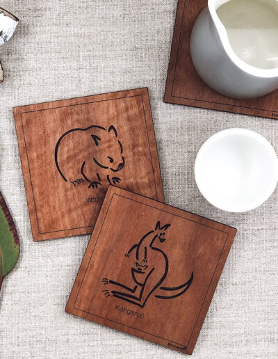 Set of six wooden square coasters and their recycled cardboard presentation box. Each coaster is a different animal. They are Emu, Koala, Wombat, Platypus, Kangaroo and Possum