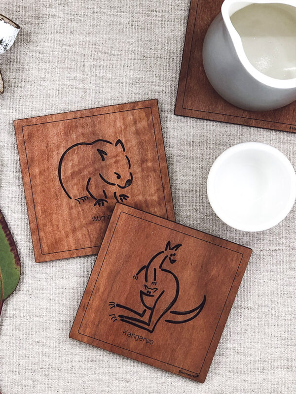 Set of six wooden square coasters and their recycled cardboard presentation box. Each coaster is a different animal. They are Emu, Koala, Wombat, Platypus, Kangaroo and Possum