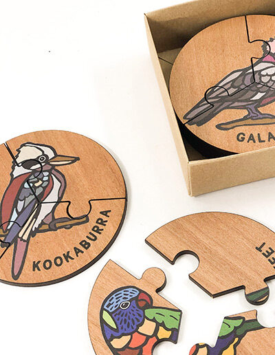 Wooden bird jigsaw puzzle set. A set of 6 different three piece bird jigsaws. Each is a round shape. They are packaged in a recycled cardboard presentation box