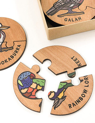 Wooden bird jigsaw puzzle set. A set of 6 different three piece bird jigsaws. Each is a round shape. They are packaged in a recycled cardboard presentation box