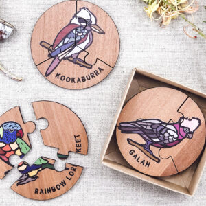Wooden bird jigsaw puzzle set. A set of 6 different three piece bird jigsaws. Each is a round shape. They are packaged in a recycled cardboard presentation box