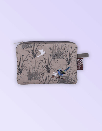 Fabric small purse with zip closure with an embroidered pair of blue wrens perched in grasses. The fabric is a natural Australian organic cotton.