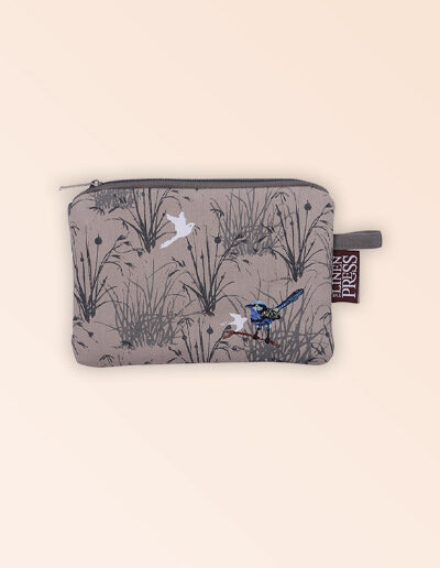 Fabric small purse with zip closure with an embroidered pair of blue wrens perched in grasses. The fabric is a natural Australian organic cotton.