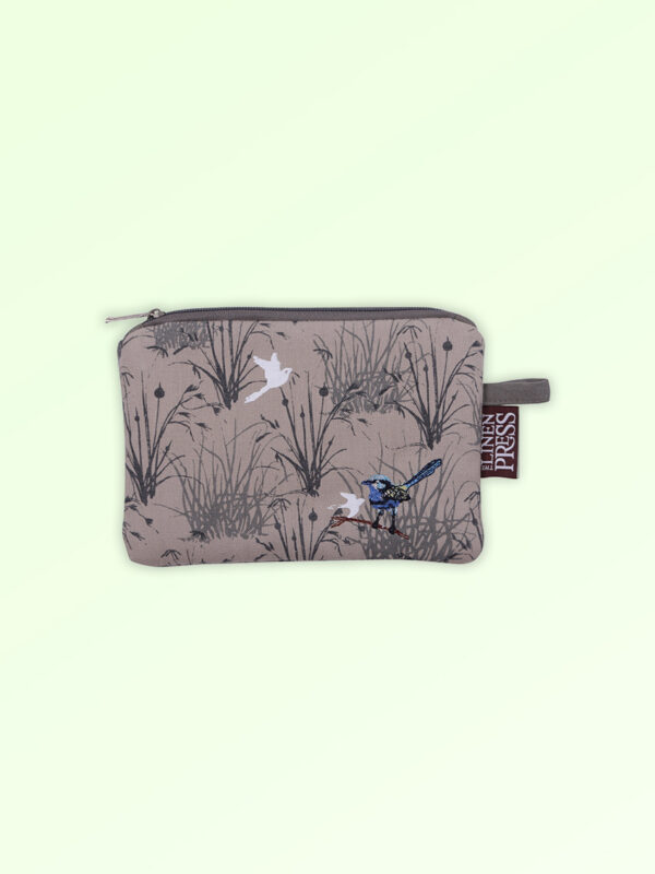 Fabric small purse with zip closure with an embroidered pair of blue wrens perched in grasses. The fabric is a natural Australian organic cotton.