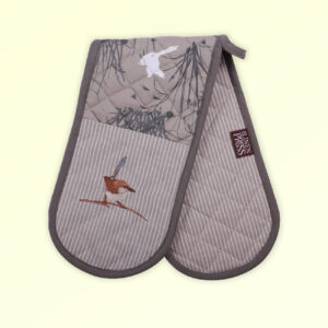 Insulated double oven mitts with an embroidered blue wren perched in grasses as the fabric design. The fabric is a natural Australian organic cotton with brown/grey trim around it and a tab to hang it.