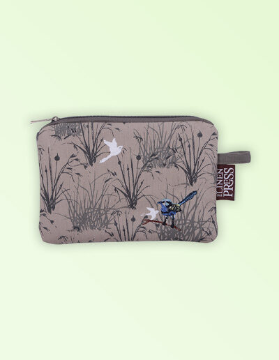 Fabric large purse with zip closure with an embroidered pair of blue wrens perched in grasses. The fabric is a natural Australian organic cotton.