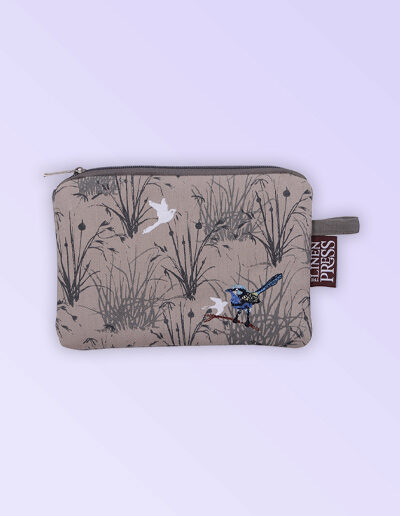 Fabric large purse with zip closure with an embroidered pair of blue wrens perched in grasses. The fabric is a natural Australian organic cotton.