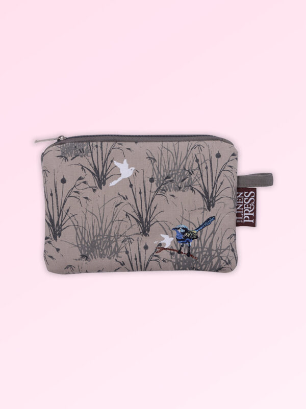 Fabric large purse with zip closure with an embroidered pair of blue wrens perched in grasses. The fabric is a natural Australian organic cotton.