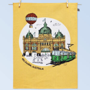 Printed cotton tea towel with the image of Melbournes Flinders Street Station and City Circle Tram