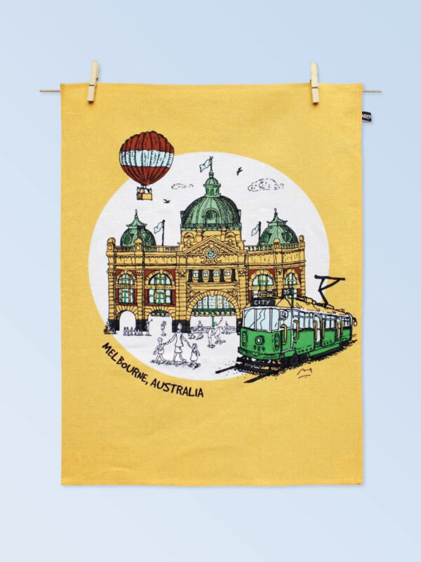 Printed cotton tea towel with the image of Melbournes Flinders Street Station and City Circle Tram
