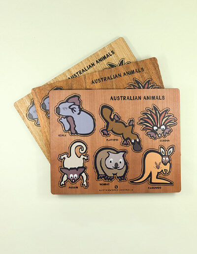 A wooden Australian animal puzzle. Rectangular in shape with 6 different colourful animal shapes to place back in the correct cut out shape.