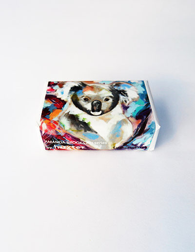Bar of soap wrapped in paper with a Koala design.