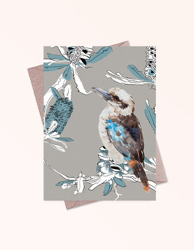 Greeting card printed in Australia. Made with recycled card. It has an image of a kookaburra and banksia flowers on the front and is blank inside.