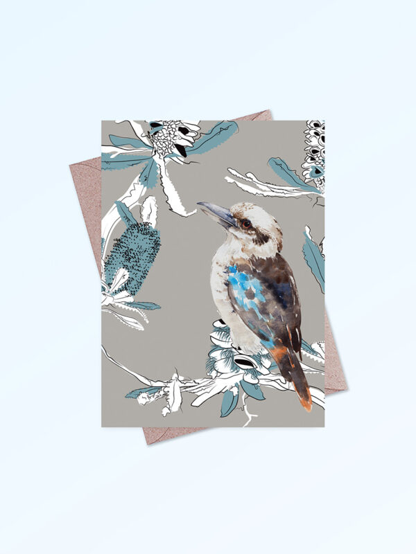 Greeting card printed in Australia. Made with recycled card. It has an image of a kookaburra and banksia flowers on the front and is blank inside.