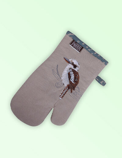 Single oven mitt, insulated. This oven mitt is made with organic cotton featuring an embroidered Kookaburra, trimmed with a blue grey cotton fabric with a hang tie