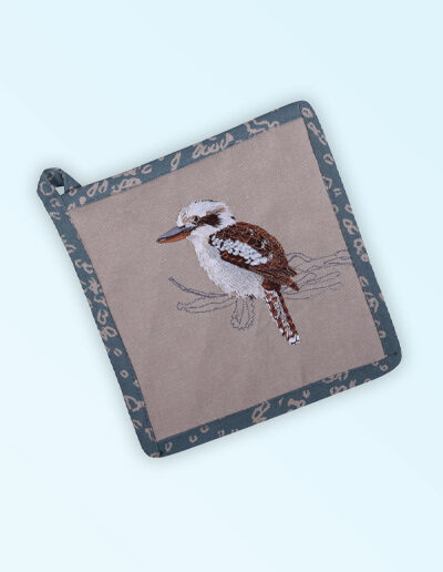 Pot holder, insulated. A square pot holder made with organic cotton featuring an embroidered Kookaburra, trimmed with a blue grey cotton fabric with a hang tie