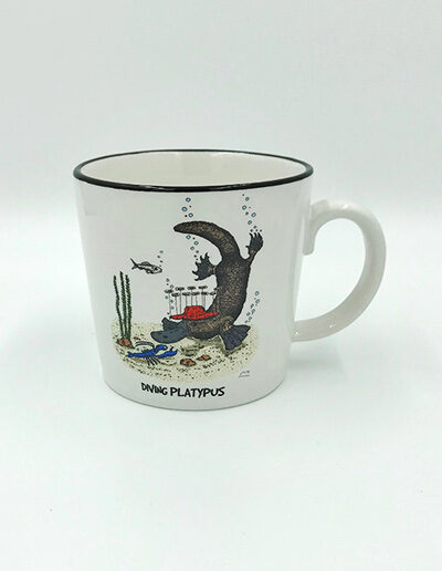 A porcelain mug with a whimsical illustration of a diving platypus on it.