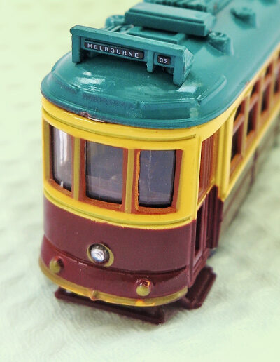 A metal model of a City Circle tram in the maroon colour.