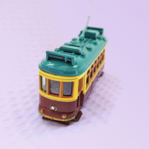 A metal model of a City Circle tram in the maroon colour.